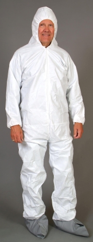 Man in white protective suit smiling.