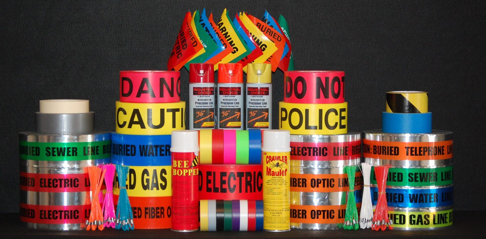 Colorful warning tapes and spray cans displayed.